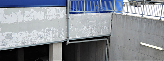 Concrete with an impermeable coating, deteriorated due to the movement of water in liquid form (capillary action) and condensation of water vapor under the coating. Again, there is a lack of deep hydrophobized concrete layer under the coating.